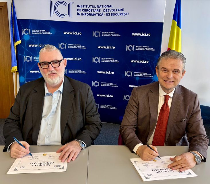 Adrian-Victor Vevera, Director General ICI București, și Ioan Lucian, Președinte UNPR, semnează acordul de cooperare pentru dezvoltarea programelor de formare profesională, la sediul ICI București, în fața unui panou oficial.